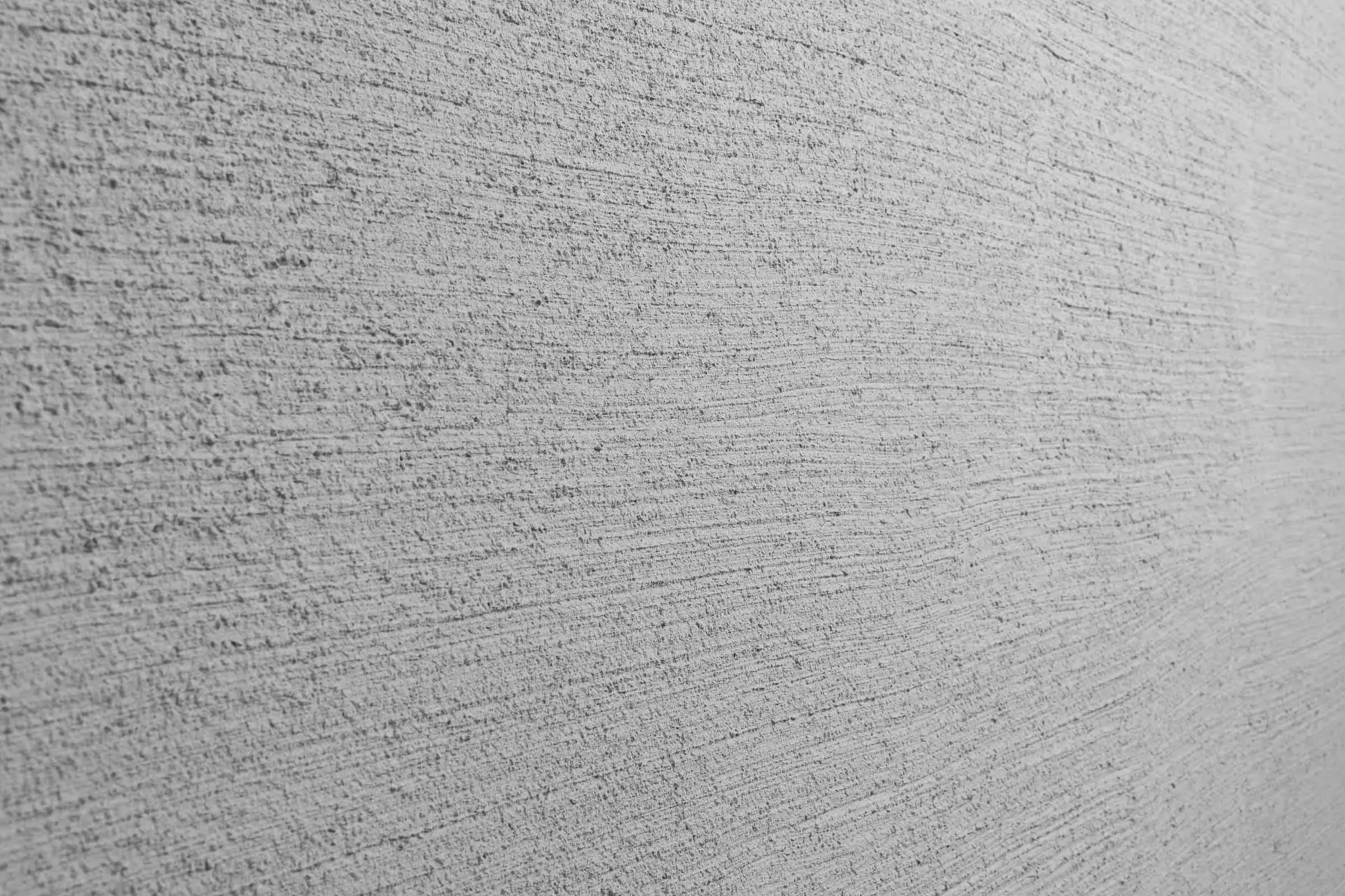 Intonaco graffiato, intonaco per facciate StoSignature texture: superficie intonacata lineare, grigi