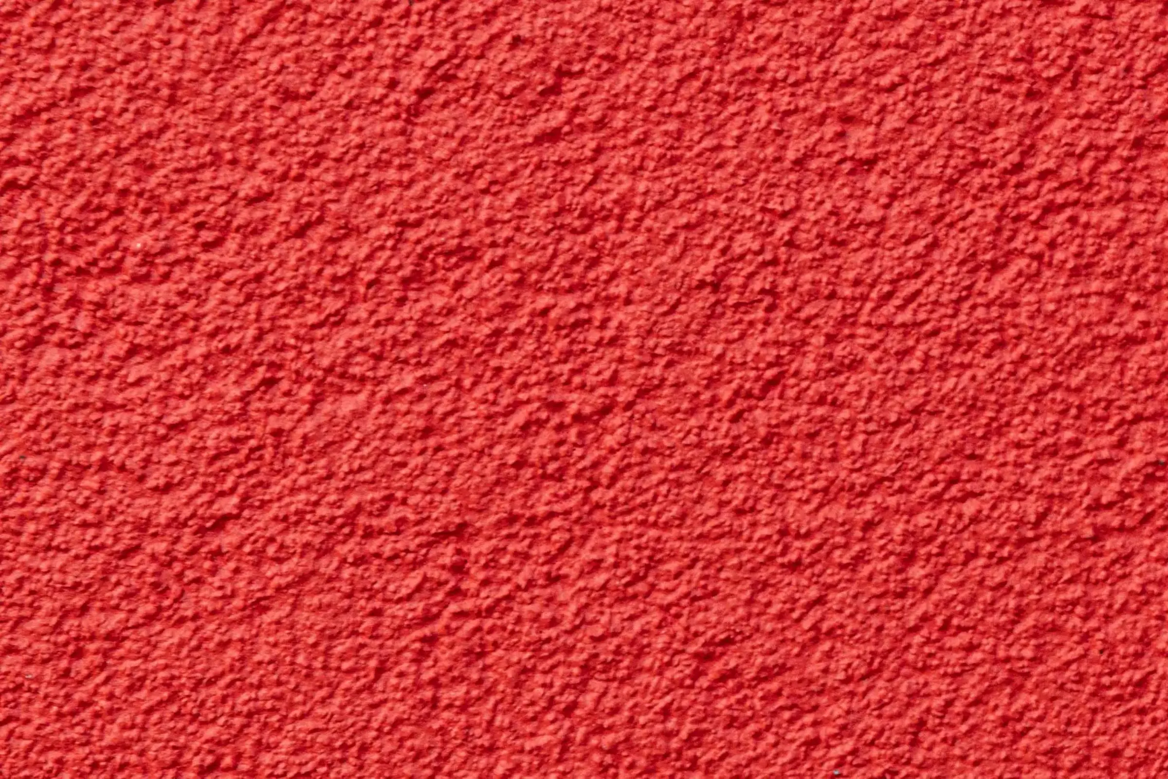 Nahaufnahme Gewerbegebäude mit der Fassadenfarbe StoColor Dryonic S in rot gestrichen.